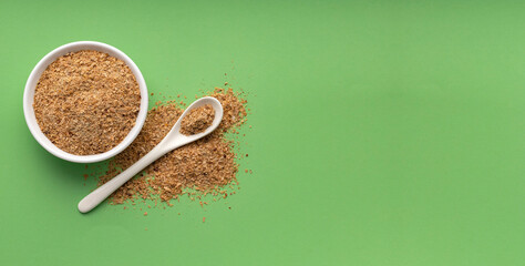 Soy fiber based powdered food in the bowl and spoon
