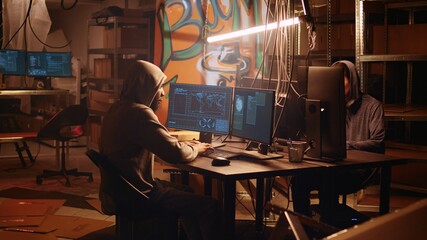 Hackers rushing to exit secret base after hearing police sirens, being wanted under custody for...