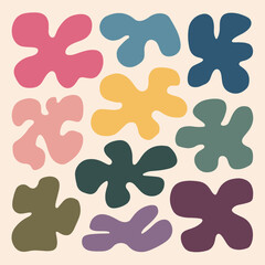 A collection of abstract shapes resembling organic forms. These shapes are in various colors, including pink, yellow, blue, green, and purple. They are spread out in a seemingly random pattern against