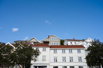 Looking up wooden apartment houses.