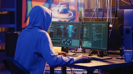 International spy using VPN and darknet as anonymity tools to mask his online identity while stealing governmental secrets. Man in underground bunker masking his location, committing espionage acts