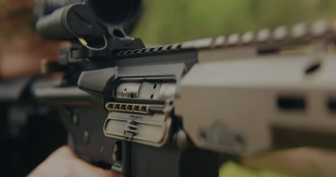 Young man shooting an AR-15