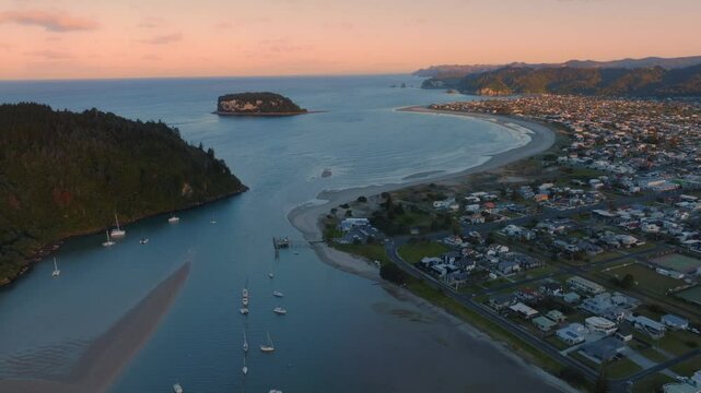 Harbour, beach and the township of  Whangamata, Coromandel Peninsula, New Zealand.