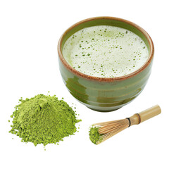 A bowl of frothy matcha tea, green tea powder, and a bamboo whisk.