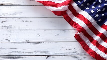 A close-up image of the edges of the United States flag positioned on a white wooden background, highlighting details and symbolizing national pride and heritage with rustic charm.