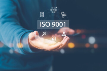 ISO standards quality control, assurance and warranty business technology concept. Businessman using laptop computer with quality assurance and document icon for ISO, ISO concept.