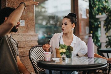 Business partners strategizing and discussing a new project at a modern coffee shop, while planning and analyzing statistics together.