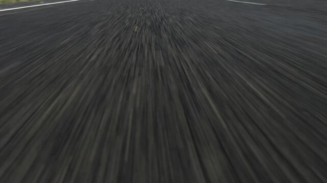 Low angle Asphalt road driving perspective POV