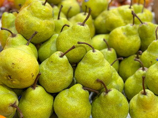 green pear display in market