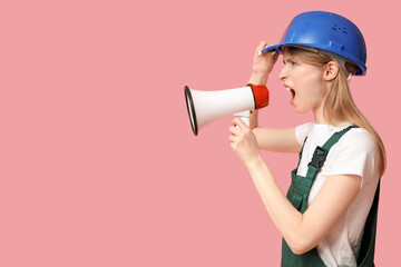 Protesting female construction worker shouting into megaphone on pink background