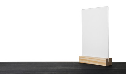 Menu holder on black wooden table against white background. Space for text