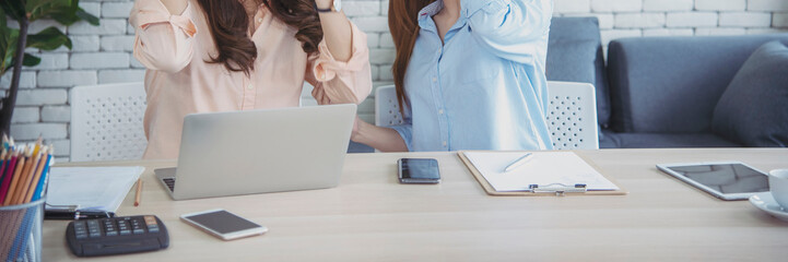 Banner Happy success business woman partner meeting working together in company office. Panoramic picture of Meeting Executive Asian business woman office desk with fist arm raised executive teamwork