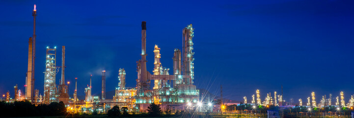 Banner Oil refinery gas petrol plant industry with crude tank, gasoline supply chemical factory. Petroleum barrel fuel heavy industry oil refinery manufacturing factory plant on twilight night time