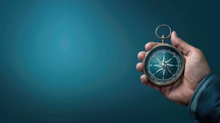 Composite image of a hand holding a compass on a blue background depicting strategic orientation in business or marketing