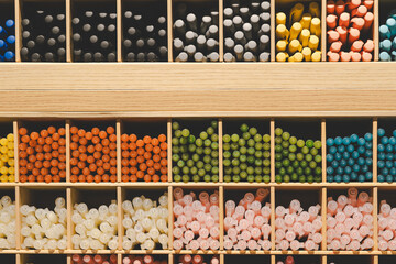 Background of lots assorted colorful pen set. Colored pens on shelves In the shop,Office supplies and stationery. Colorful pens arranged on shelves selling stationery.