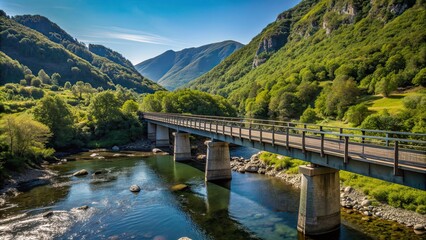 Fototapeta premium Bridge crossing a river in a mountain valley, mountain, valley, river, bridge, crossing, picturesque, nature