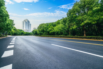 Empty asphalt road and trees background