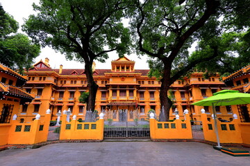 Historical yellow buildings of French Colonial style at Ha Noi Vietnam