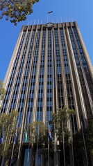 Majestic office building of the Australian Department of Foreign Affairs, featuring a grand facade and flags, representing governmental authority and international relations.