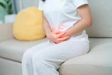 woman having abdomen ache due to Stomach pain, digestion with constipation or Diarrhea from food...