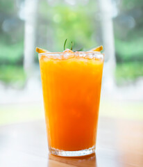 Fresh cold Orange juice with ice served in the summer in a restaurant to refresh yourself during a hot day