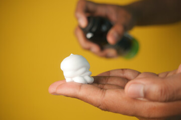  top view of shaving foam on hand 