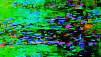 Blurred purple and green clips with many different colors. The colors are very bright and the picture is very busy.