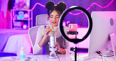 ASMR, neon and influencer woman with microphone, ring light and audio content creator in home...