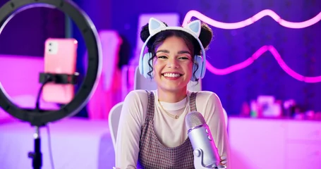 Fotobehang Gaming Ring light, girl and portrait for live streaming, gaming or talking to social media followers, fans or audience at home. Excited content creator, influencer or cool gamer in POV screen and neon room  © CineLens2024/peopleimages.com