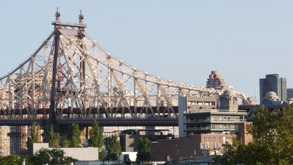 Naklejka premium New York City Manhattan skyline cityscape. Queensboro Bridge from Queens to Midtown. Rooftop view point, roof in Long Island, United States. NYC urban architecture in Hunters Point