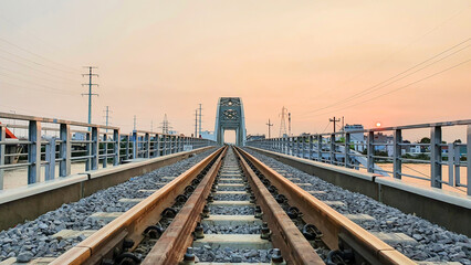 Fototapeta premium New Binh Loi Railway Bridge At Sunset In Ho Chi Minh City, Vietnam. New Binh Loi Railway Bridge Was Built To Replace The Old One, Which Has Been In Operation For 110 Years