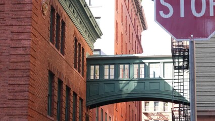 New York City Staple street skybridge. Vintage retro industrial architecture red brick building....