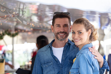 happy couple grocery shopping at the local market