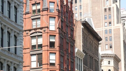 New York City Manhattan Midtown classic building architecture, urban street in United States. American residential and business real estate on Broadway in USA. Red brick house.