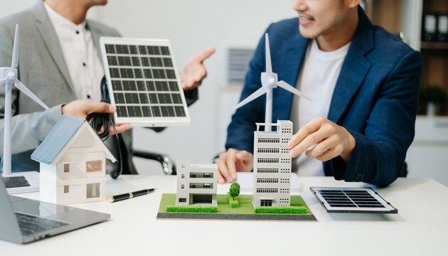 ESG concept of environmental, Green ethical business preserving resources, reducing CO2, Business person team working on laptop virtual smartphone