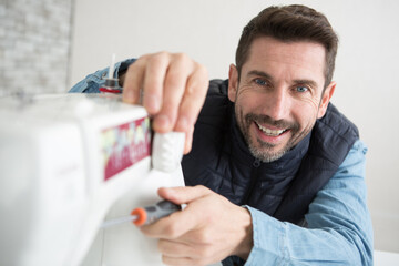 man fixing the shuttle a needle
