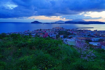 Sunset view of Pozzuoli and the Bay of Naples, built on the sides of the Phlegraean Fields (Campi Flegrei), an active caldera volcano part of the Campanian volcanic arc