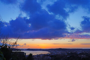 Obraz premium Sunset view of Pozzuoli and the Bay of Naples, built on the sides of the Phlegraean Fields (Campi Flegrei), an active caldera volcano part of the Campanian volcanic arc