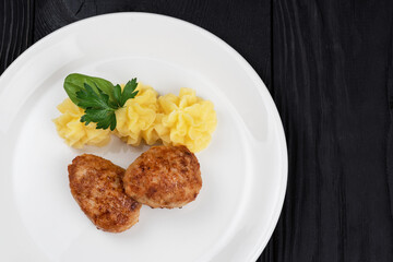 Chicken meat cutlet with mashed potatoes on white plate