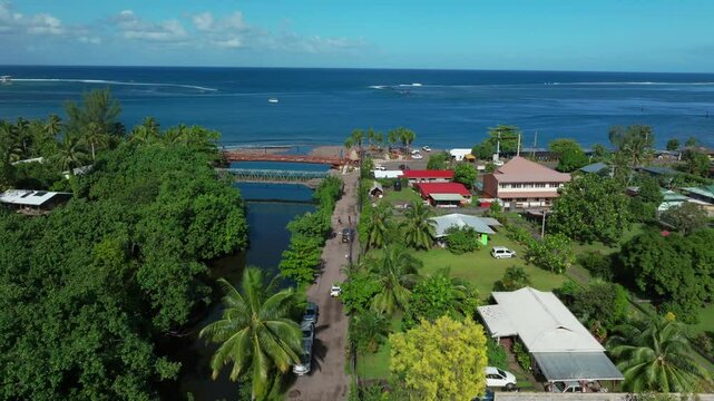 Teahupoo Tahiti French Polynesia aerial drone view end of the road new Olympics pedestrian bridge van car drive island coast to Papeete morning sunny bay channel coral reef valley river forward motion