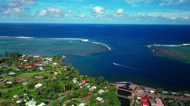 Teahupoo Tahiti French Polynesia aerial drone Papeete morning sunny sunshine boat bay channel coral reef Paris Olympics 2024 surf surfer surfer venue new judge tower pedestrian bridge down motion
