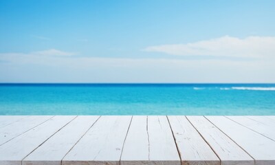 Fototapeta premium White wooden table against a blurred ocean background