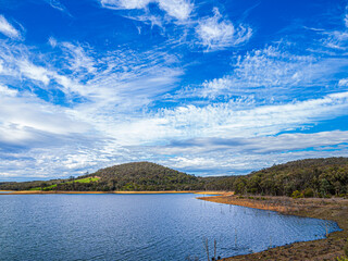 Lustrous Wind Blown Clouds Over Lake