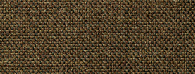 Texture dark brown background from woven textile with wicker pattern, macro. Vintage umber fabric