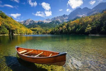 A canoe resting on the edge of an idyllic lake, surrounded by autumn foliage and gentle ripples in the water. An outdoor adventure travel concept. 