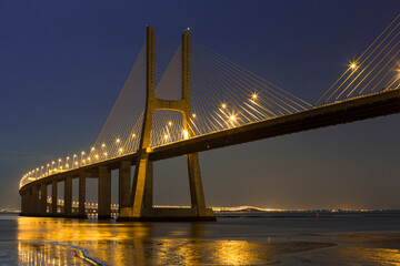 Fototapeta premium Famous Scenic Picturesque Vasco Da Gama Bridge in Lisbon in Portugal With Picture Made At Night