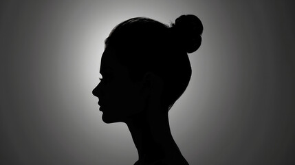 Striking silhouette portrait of a young woman in a studio setting.