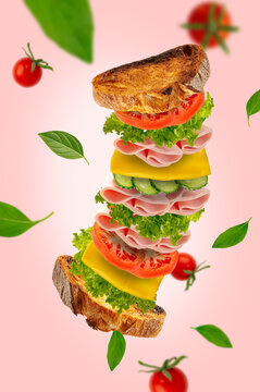 sandwich with ham, cheese and vegetables. levitation.