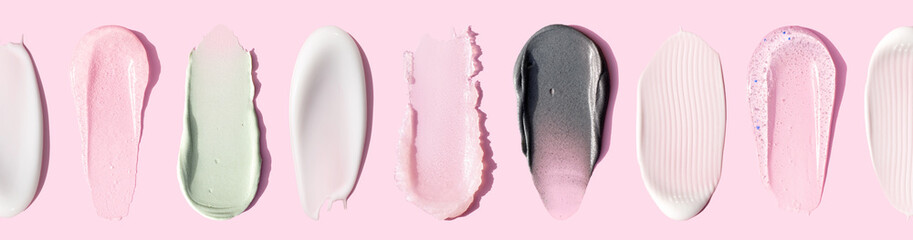banner creamy texture of cosmetic samples on pink background