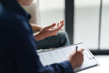 Professional psychologist conduct a consulting with sad patient in clinic